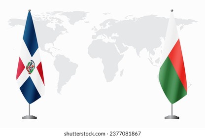 Dominican Republic and Madagascar flags for official meeting against background of world map.