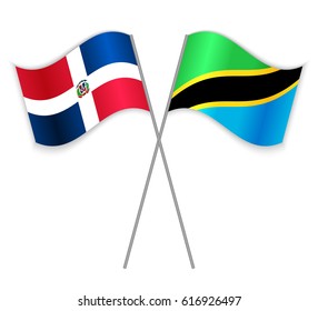 Dominican and Tanzanian crossed flags. Dominican Republic combined with Tanzania isolated on white. Language learning, international business or travel concept.