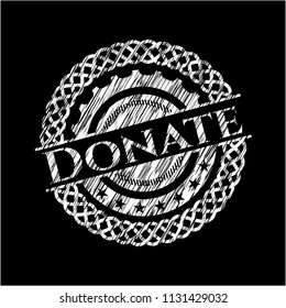 Donate chalk emblem written on a blackboard