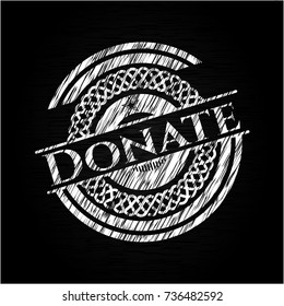 Donate chalk emblem written on a blackboard