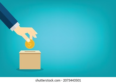 Donación, concepto de donación. Mano humana con moneda de oro y caja de donación.	