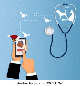 Donate money with mobile phone. Charity, donation concept. Online payment with smartphone. Donation on veterinary clinic. Christmas charity