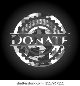 Donate on grey camouflage texture