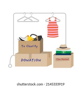 Donating clothes for charity. Used clothes packed in cardboard boxes. 