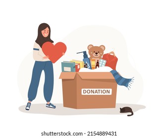 Donation box with clothes, toys, books and medicines. Arabic volunteer woman holding in hands heart. Share your love. Support for poor people and children. Vector illustration in flat cartoon style.