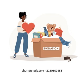 Donation box with clothes, toys, books and medicines. African volunteer woman holding in hands heart. Share your love. Support for poor people and children. Vector illustration in flat cartoon style. svg