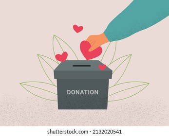 Caja de donaciones y concepto de amor. Mano humana poniendo corazones rojos en caja de donaciones