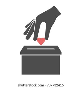 Donation icon concept. Hand putting red heart in the box