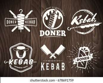 Doner kebab logos. Vector kebab badges with traditional eastern grill dishes on retro wooden background. Vintage labels for restaurant or bar.