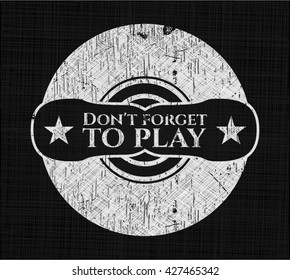 Don't forget to play chalk emblem written on a blackboard