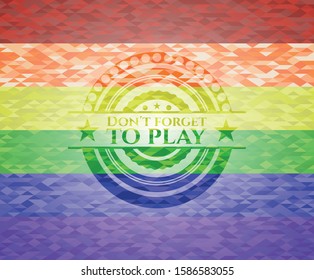 Don't forget to play emblem on mosaic background with the colors of the LGBT flag