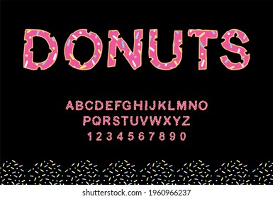 Donut bite fonts with black background. Bitten letter is pink with a donut motif. Bakery sweet alphabet