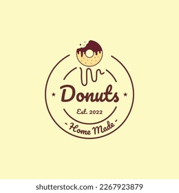 Icono del logotipo de donut mordidos o donados con poco dulce. Donut Shop o Bakery Emblem.