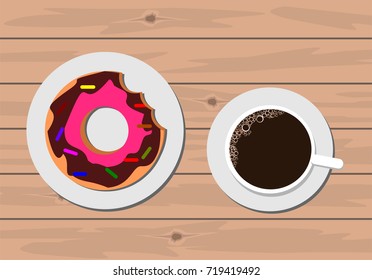 Donut and coffee on wooden table