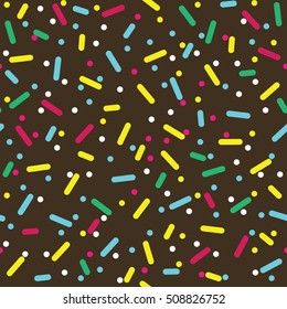 Donut glaze seamless pattern. Cream texture with topping of colorful sprinkles and beads on chocolate background. Food bakery decoration. Vector eps8 illustration.