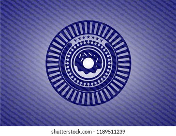 donut icon inside badge with denim background