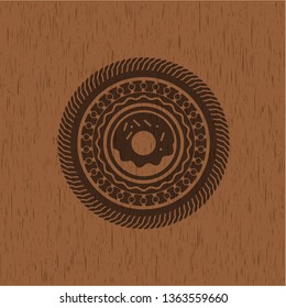donut icon inside badge with wood background