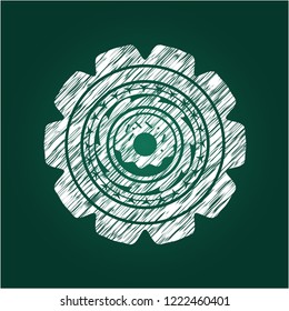 donut icon inside chalkboard emblem written on a blackboard
