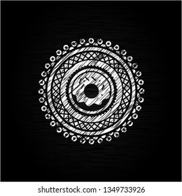 donut icon inside chalkboard emblem written on a blackboard