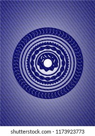 donut icon inside emblem with denim texture