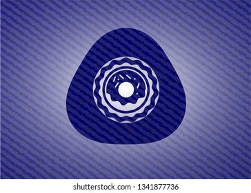 donut icon inside emblem with denim texture