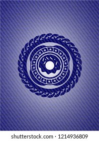 donut icon inside emblem with jean background