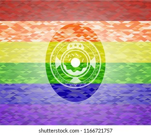 donut icon inside emblem on mosaic background with the colors of the LGBT flag