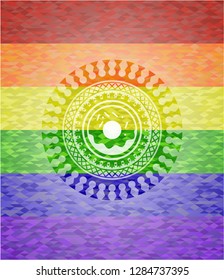 donut icon inside emblem on mosaic background with the colors of the LGBT flag
