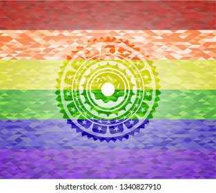 donut icon inside emblem on mosaic background with the colors of the LGBT flag