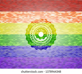 donut icon inside emblem on mosaic background with the colors of the LGBT flag