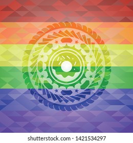 donut icon inside emblem on mosaic background with the colors of the LGBT flag