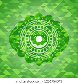 donut icon inside green emblem with mosaic ecological style background