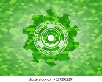 donut icon inside green emblem with mosaic ecological style background