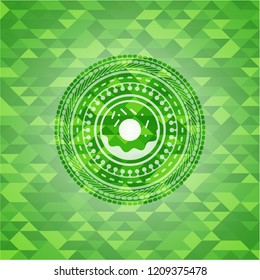 donut icon inside green mosaic emblem
