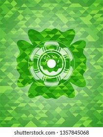 donut icon inside green mosaic emblem