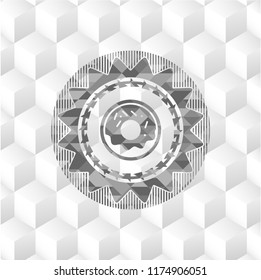 donut icon inside grey badge with geometric cube white background