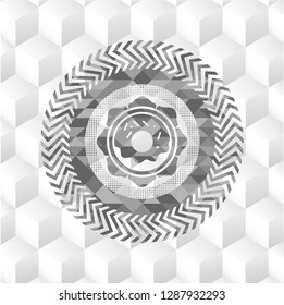 donut icon inside grey badge with geometric cube white background
