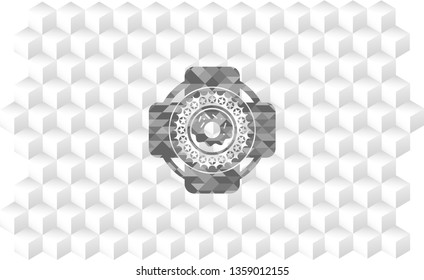 donut icon inside grey badge with geometric cube white background