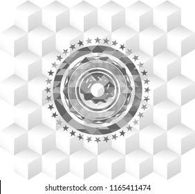 donut icon inside grey emblem with geometric cube white background