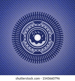 donut icon inside jean or denim emblem or badge background