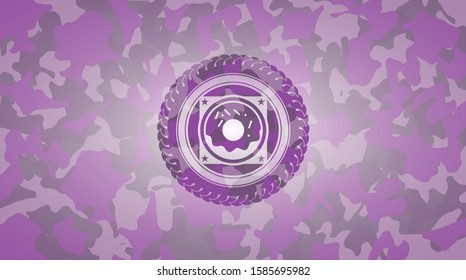 donut icon inside pink camo emblem