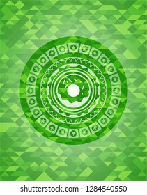donut icon inside realistic green emblem. Mosaic background