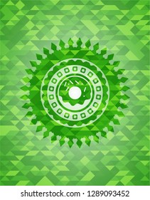 donut icon inside realistic green mosaic emblem
