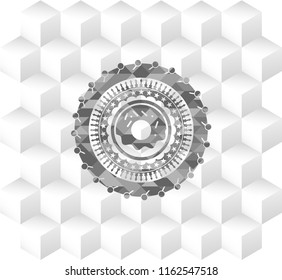 donut icon inside realistic grey emblem with geometric cube white background