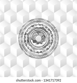 donut icon inside realistic grey emblem with geometric cube white background