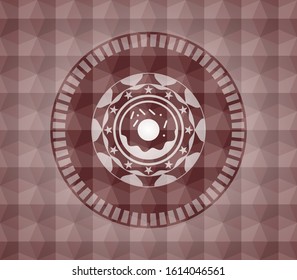 donut icon inside red seamless emblem with geometric pattern.