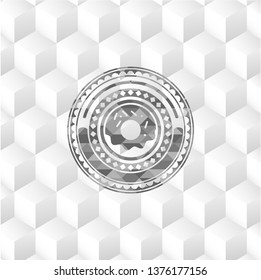 donut icon inside retro style grey emblem with geometric cube white background