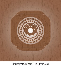 icono de donut dentro del emblema de madera estilo retro