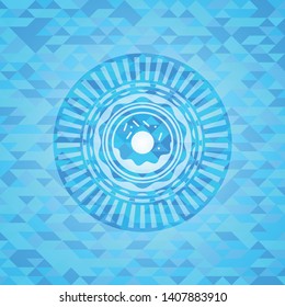 donut icon inside sky blue emblem with mosaic background