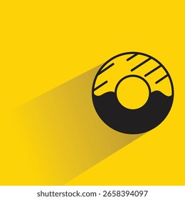 Donut-Symbol mit Schatten auf gelbem Hintergrund